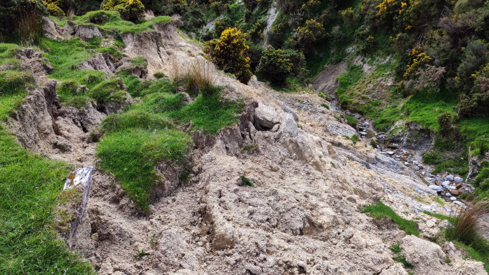 Erosion at the toe of an earth flow